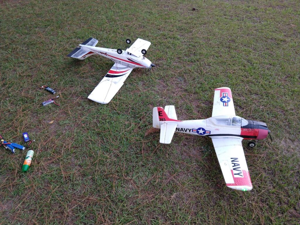 Apprentice 15 upside down for battery insertion; T-28 Trojan ready for take-off